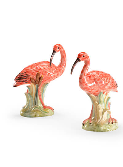 Two pink ibis bird figures